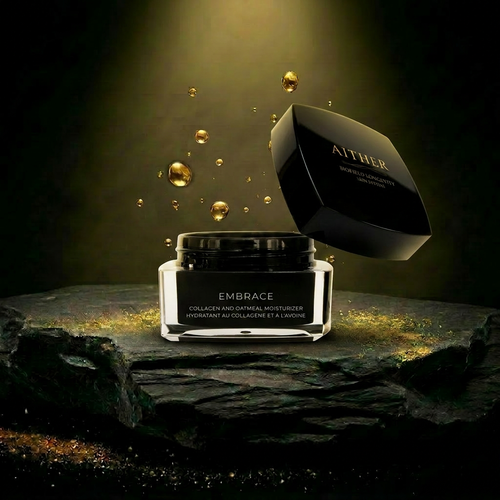 AITHER Embrace Collagen Moisturizer on dark schist pedestal with golden droplets