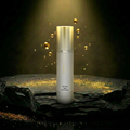 AITHER Oil-Free Daily Moisturizer on luxury rock pedestal with golden droplets